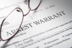 Arrest Warrant document with reading glasses concept for Once you learn warrant for arrest has been issued in your name you should immediately contact a criminal defense attorney.