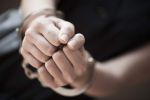 Woman in handcuffs, close-up of hands. concept for Understanding Your Criminal Case - Arrest and Pre-Trial Procedure